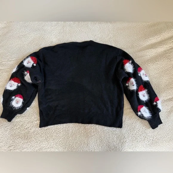 Brand new, never worn, Festive Black Sweater with Santa Faces from Krush Kandy - Picture 2 of 2